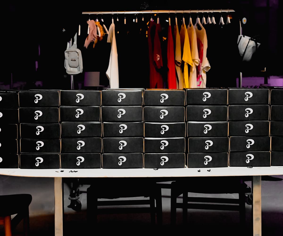 Partiful VIP box featuring a welcome card and branded party items.