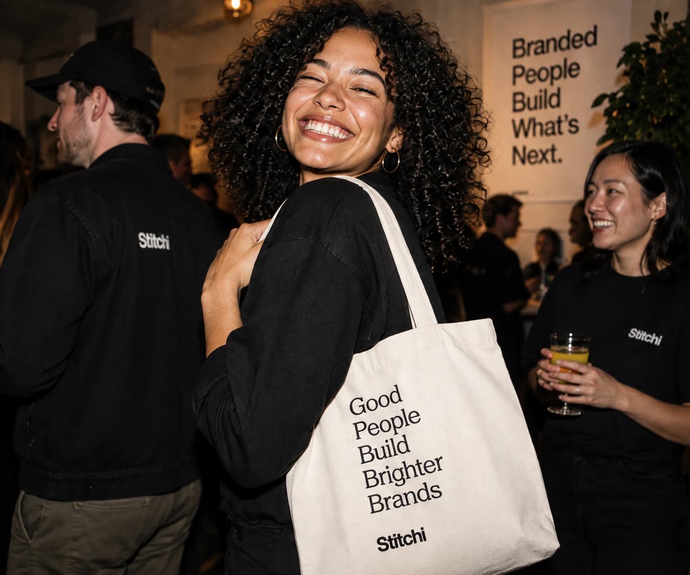 Guests wearing Stitchi apparel at a branded event